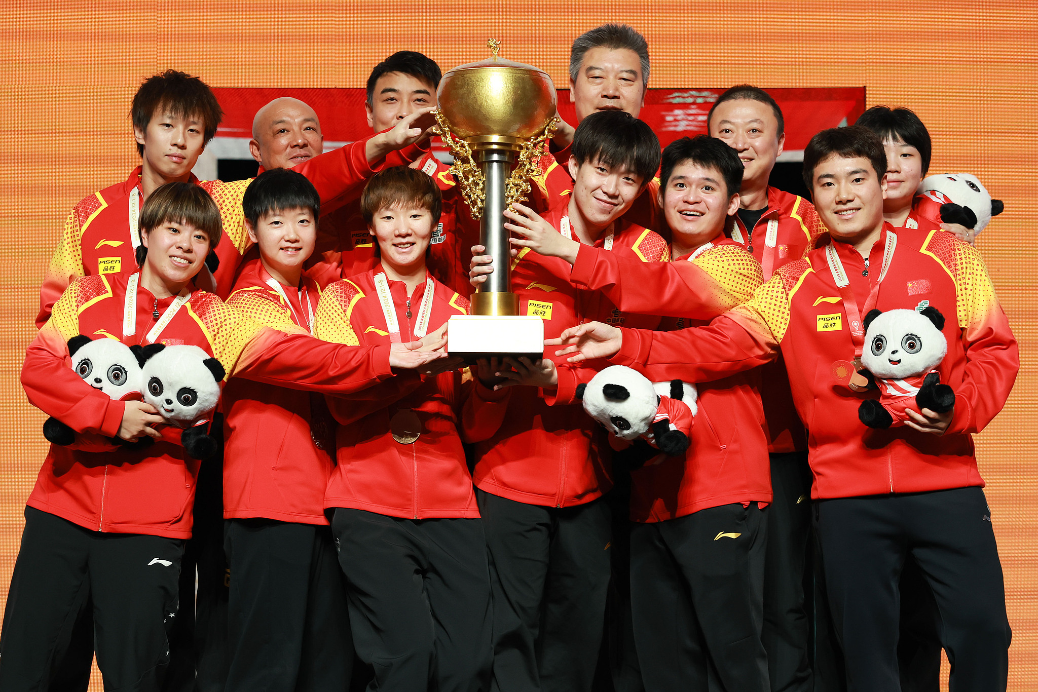 Players and coaches of China celebrate winning the  International Table Tennis Federation (ITTF) Mixed Team World Cup title in Chengdu, southwest China's Sichuan Province, December 8, 2024. /CFP