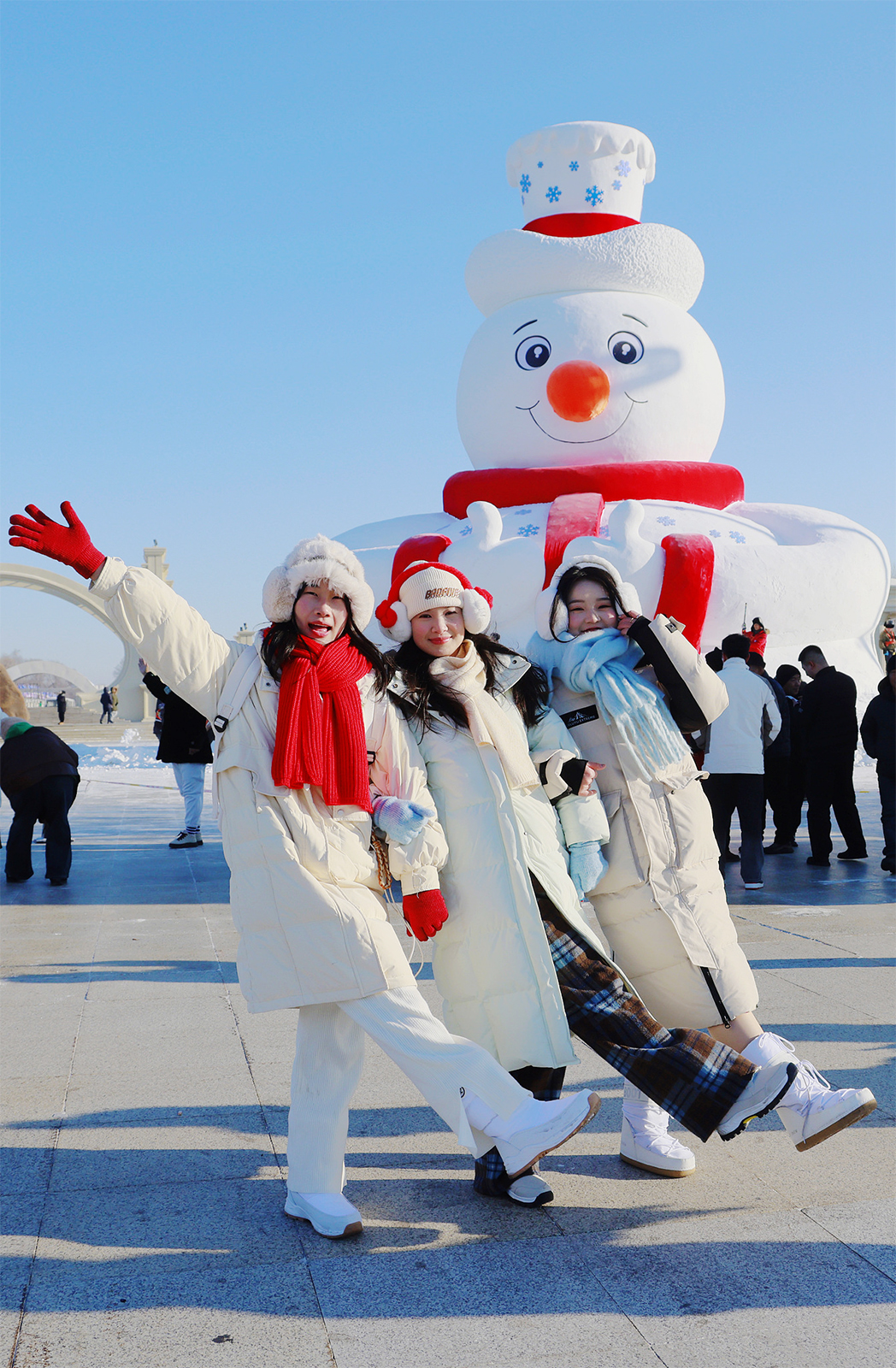 Visitors pose for photos with 