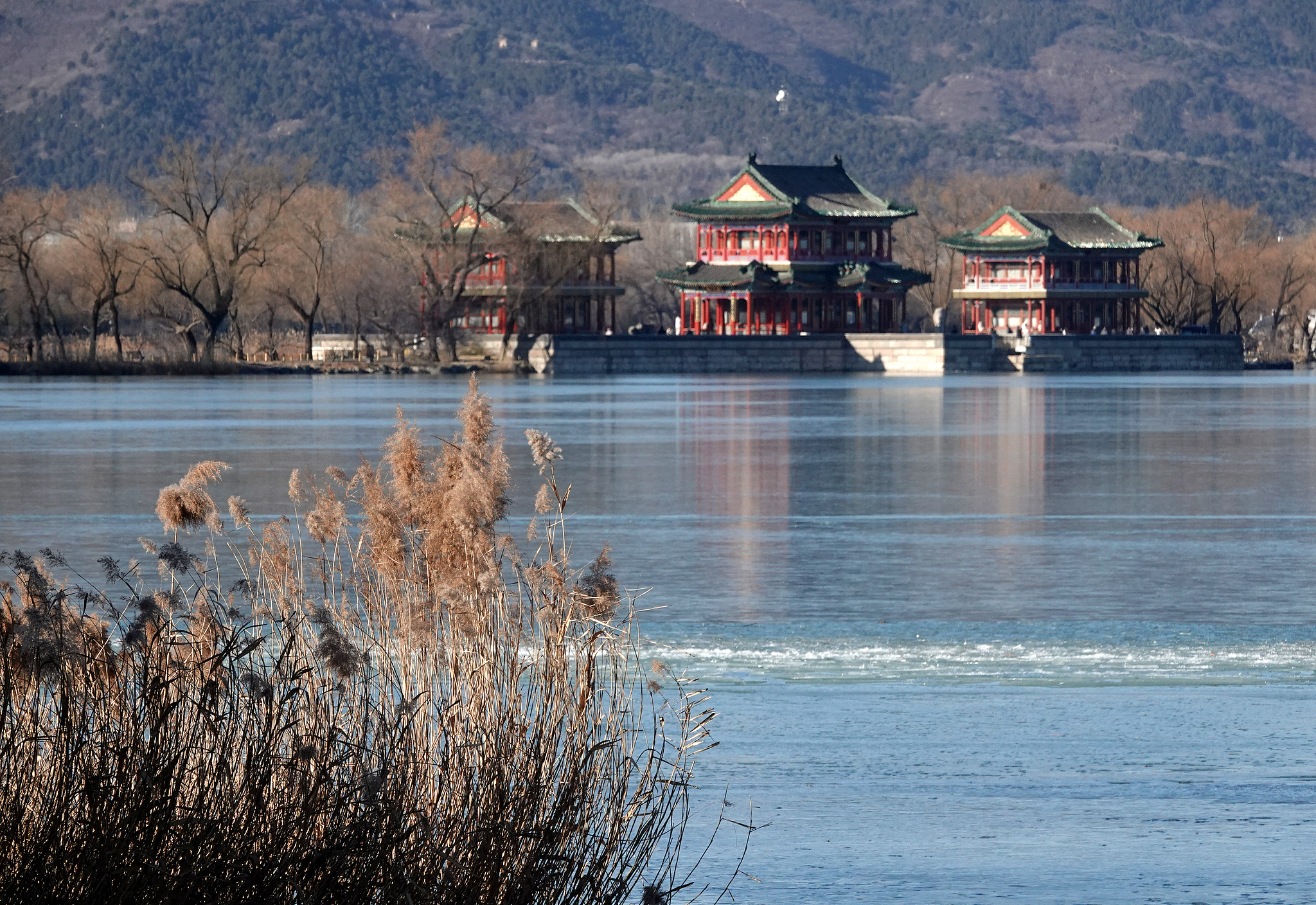 Mountains and embankments reflects on the frozen surface of Kunming Lake at the Summer Palace, Beijing, December 9, 2024. /CFP
