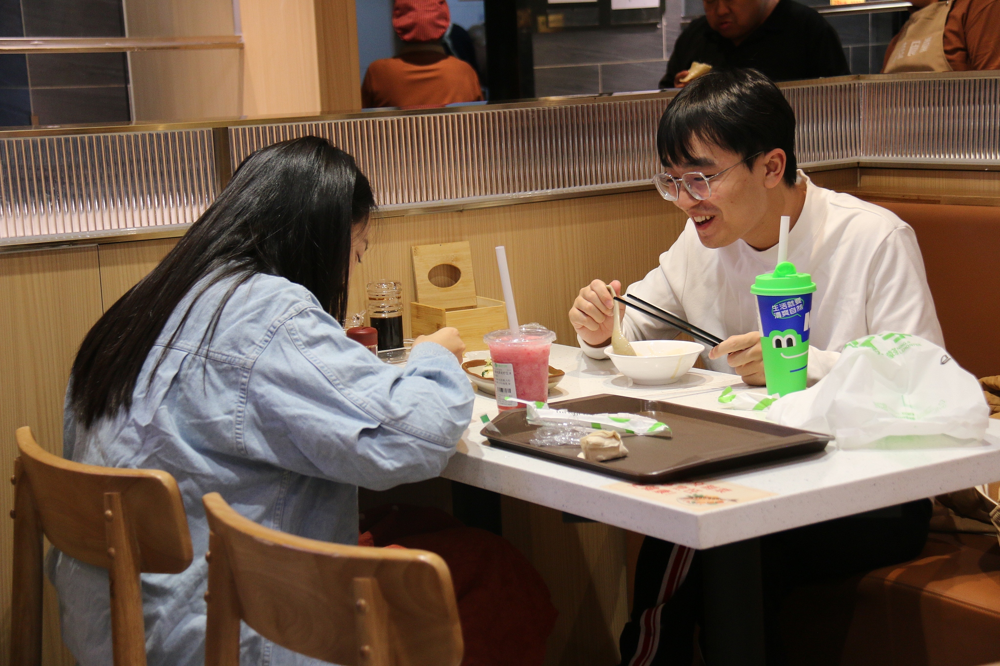 A couple enjoy dinner at a community canteen in Haidian District, Beijing, October 10, 2024. /CFP