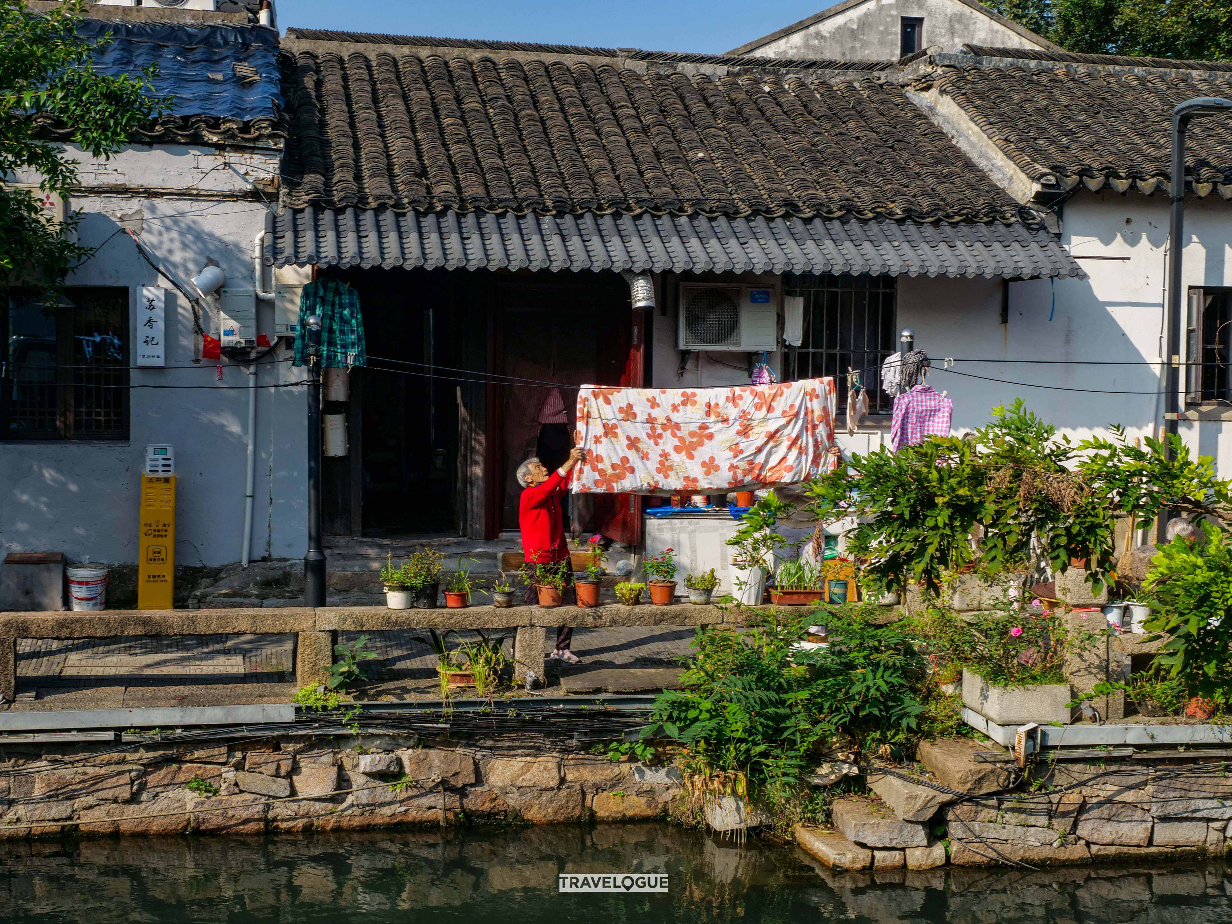 A photo shows the daily life of locals living along the canals in the old quarter of Suzhou, Jiangsu Province. /CGTN