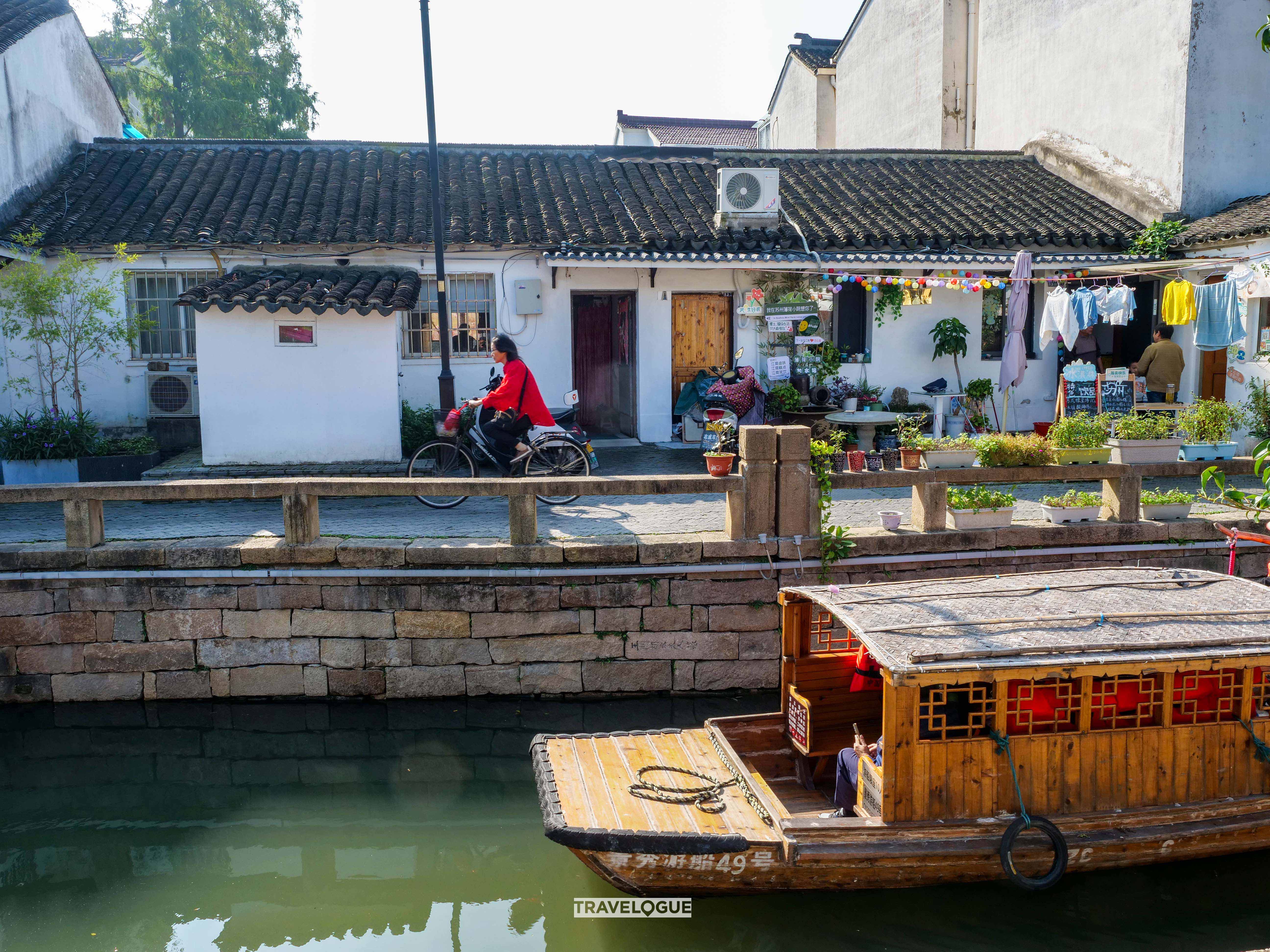 A photo shows the daily life of locals living along the canals in the old quarter of Suzhou, Jiangsu Province. /CGTN