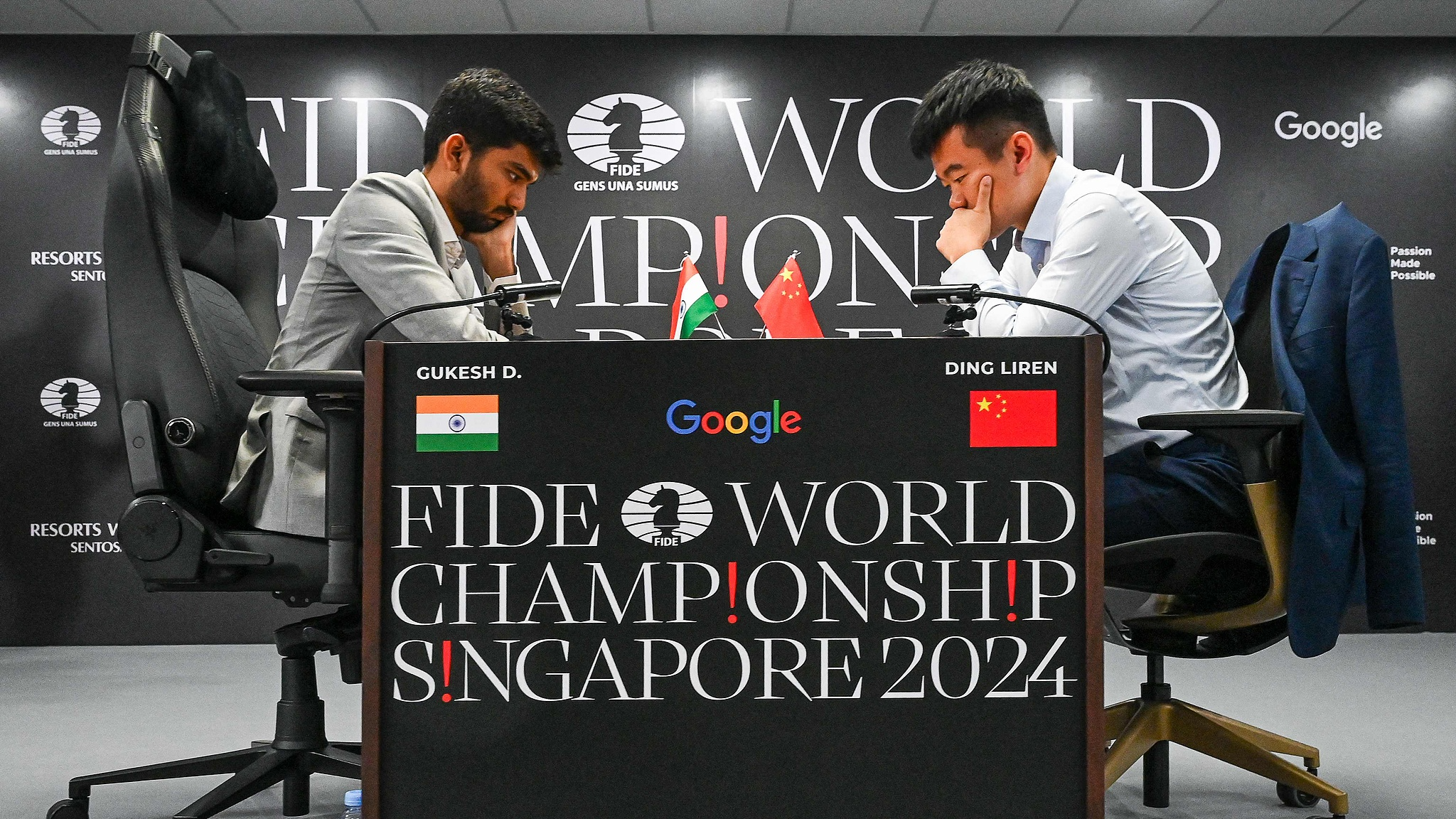 Teenager Gukesh Dommaraju of India (L) beat defending champion Ding Liren of China in the last game of a 14-game match in Singapore, December 12, 2024. /CFP