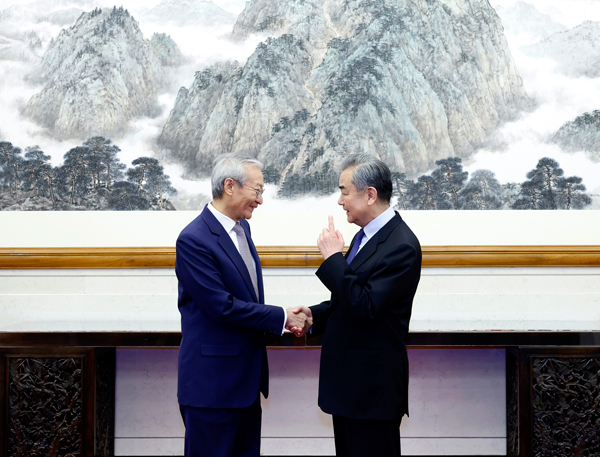 Chinese Foreign Minister Wang Yi (R) meets with Shanghai Cooperation Organization (SCO) Secretary-General Zhang Ming in Beijing, China, December 13, 2024. /Chinese Foreign Ministry