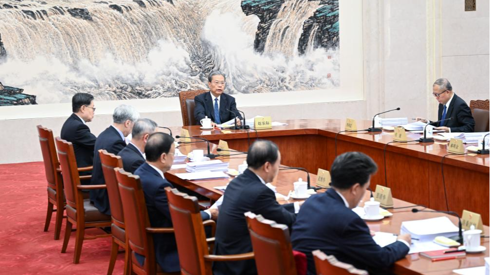 Zhao Leji, chairman of the National People's Congress (NPC) Standing Committee, presides over the 35th meeting of the Council of Chairpersons of the 14th NPC Standing Committee at the Great Hall of the People in Beijing, China, December 13, 2024. /Xinhua