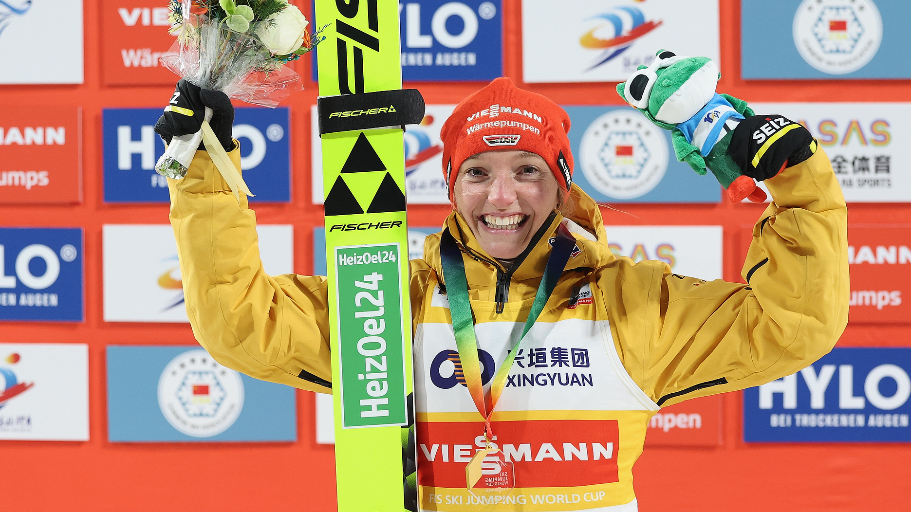 Katharina Schmid in the victory ceremony of the women's normal hill competition at the FIS Ski Jumping Women's World Cup in Zhangjiakou, China, December 14, 2024. /CFP