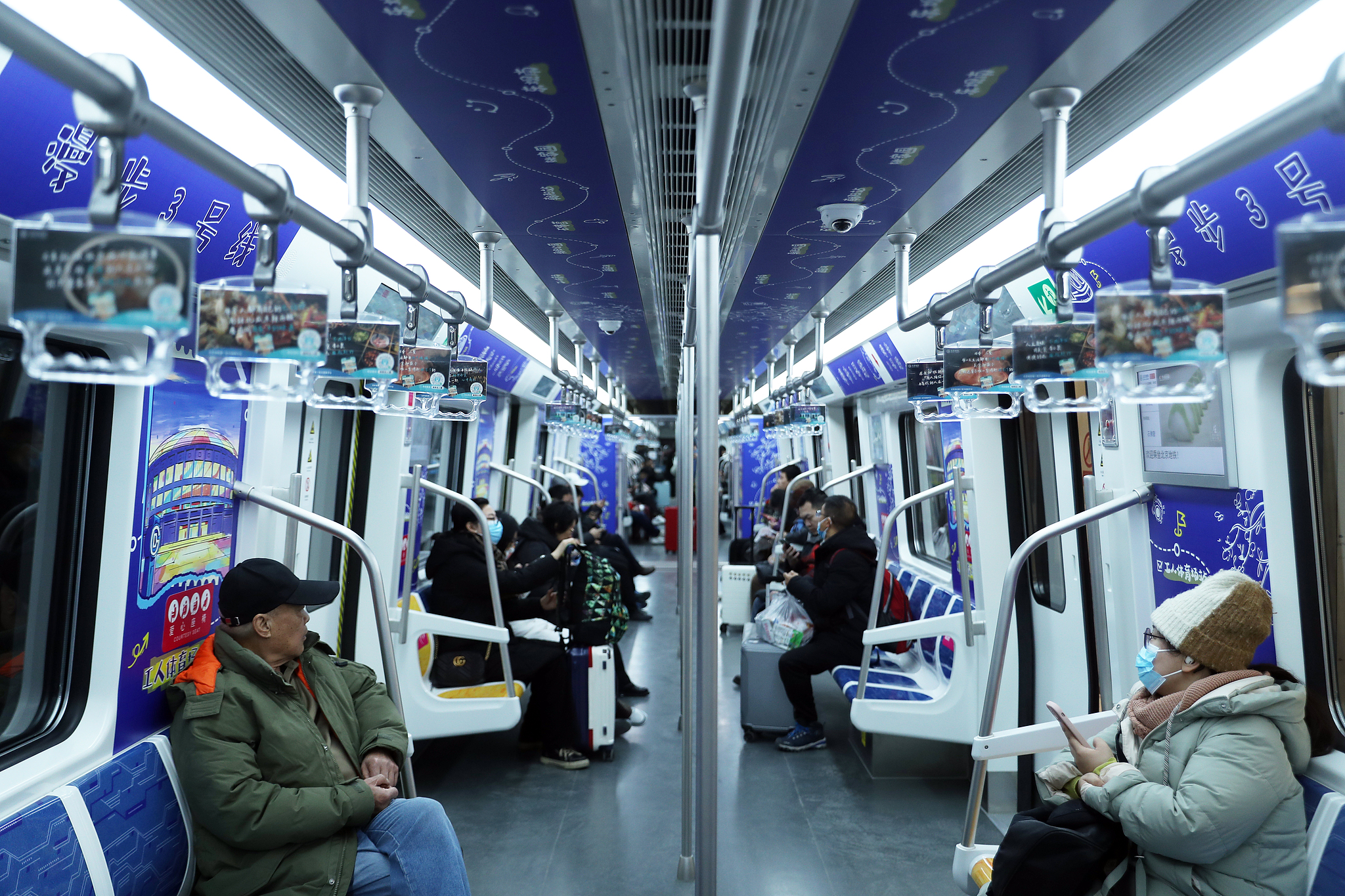 Passengers take a train on Subway Line 3 in Beijing, December 15, 2024. /CFP