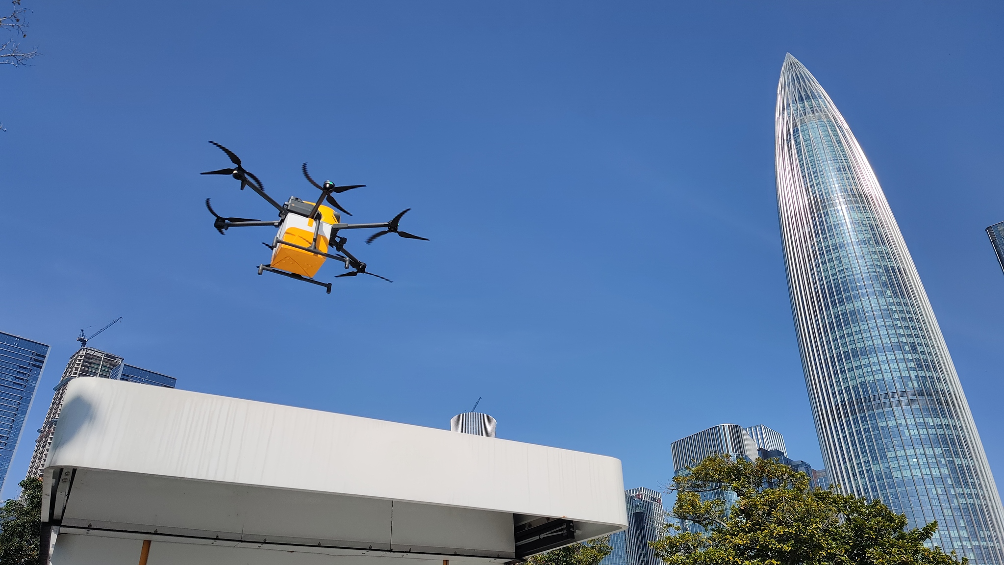 A drone delivers takeaway food to people in Shenzhen, south China's Guangdong Province, December 10, 2024. /CFP