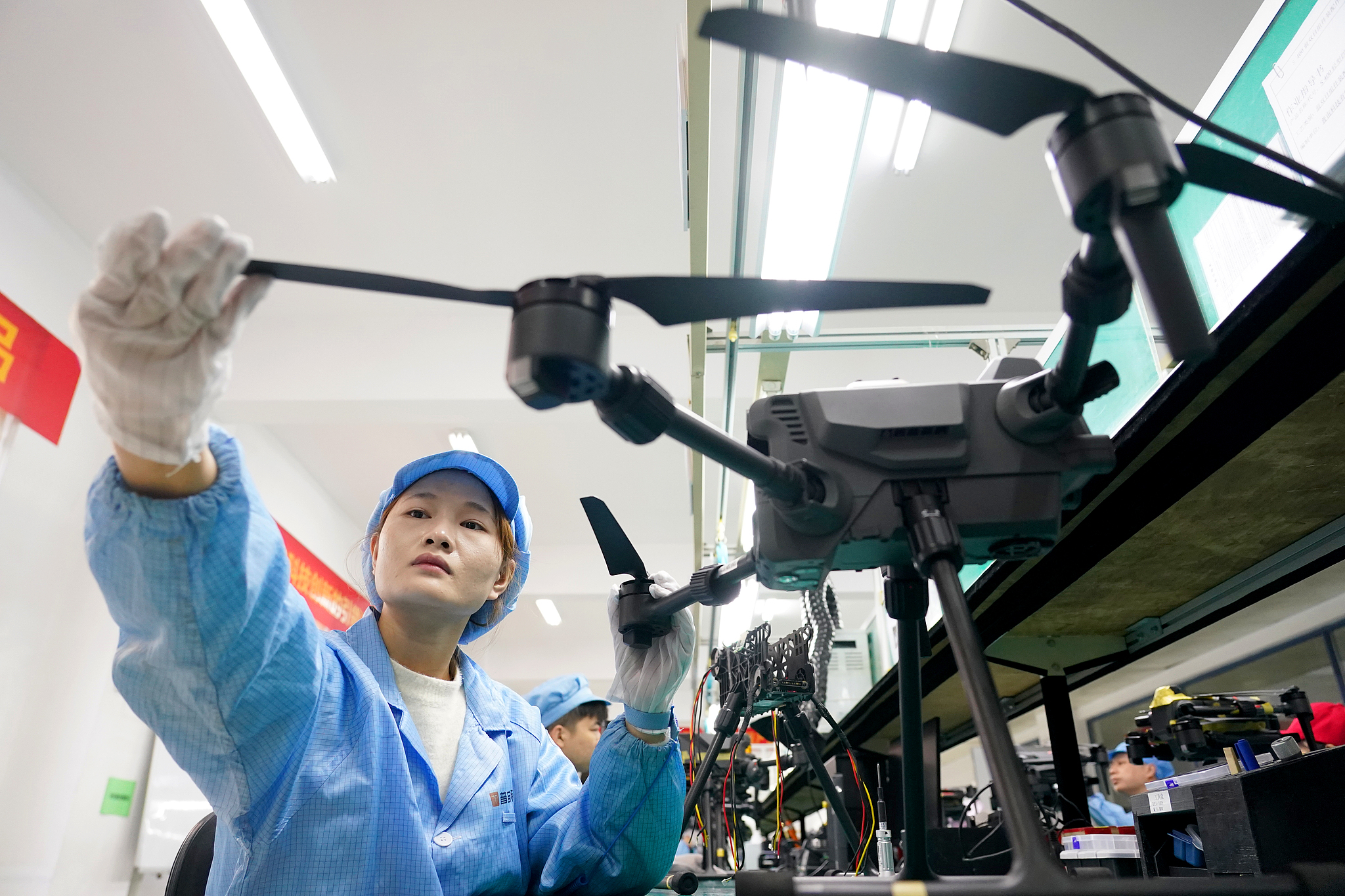 A technician checks the equipment at a UAV production line in Wuhan, central China's Hubei Province, November 28, 2024. /CFP