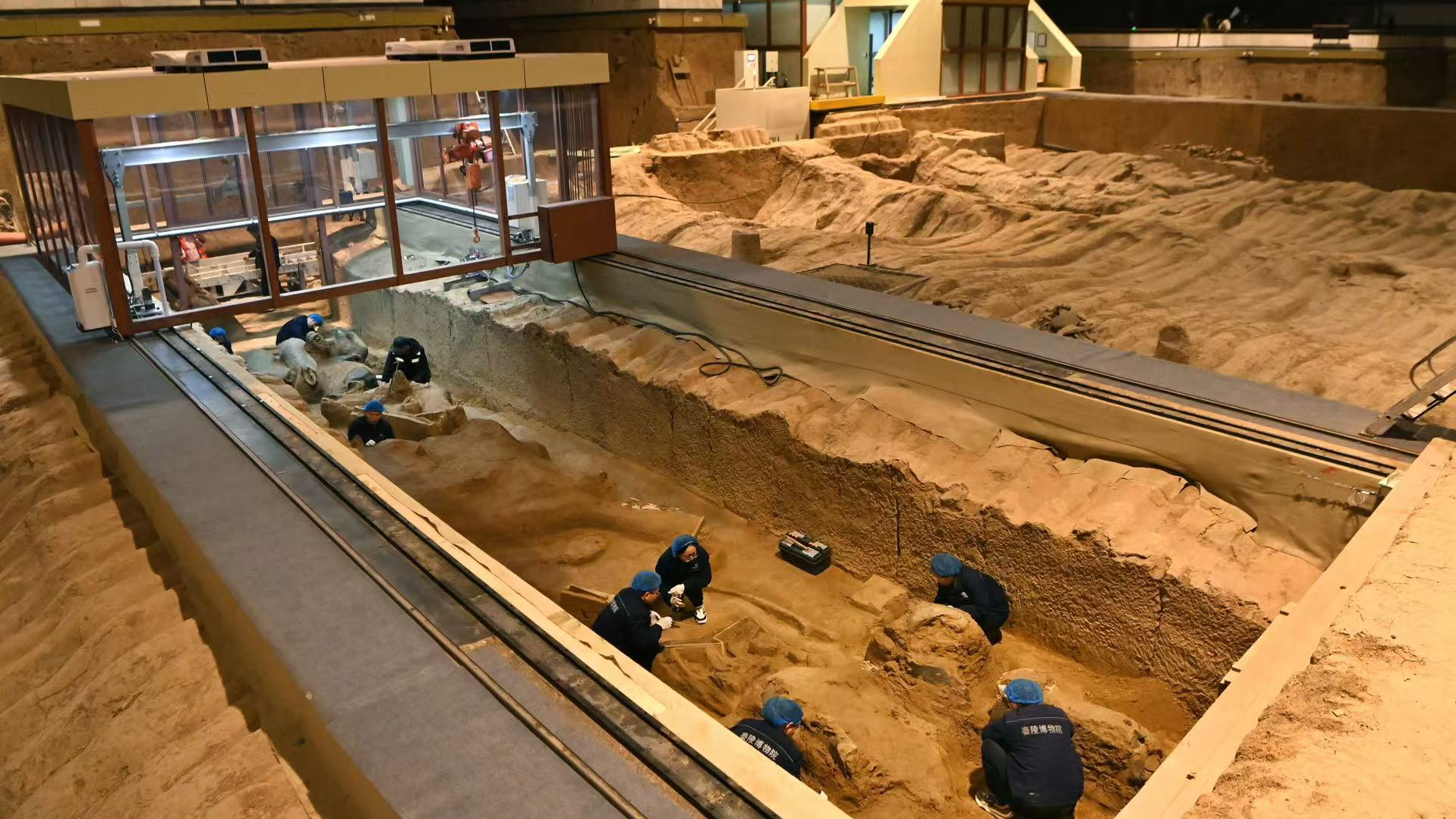 Experts at work during the excavation of the Terracotta Warriors in Xi'an City of northwest China's Shaanxi Province, December 16, 2024. /Photo by Zhang Tianzhu