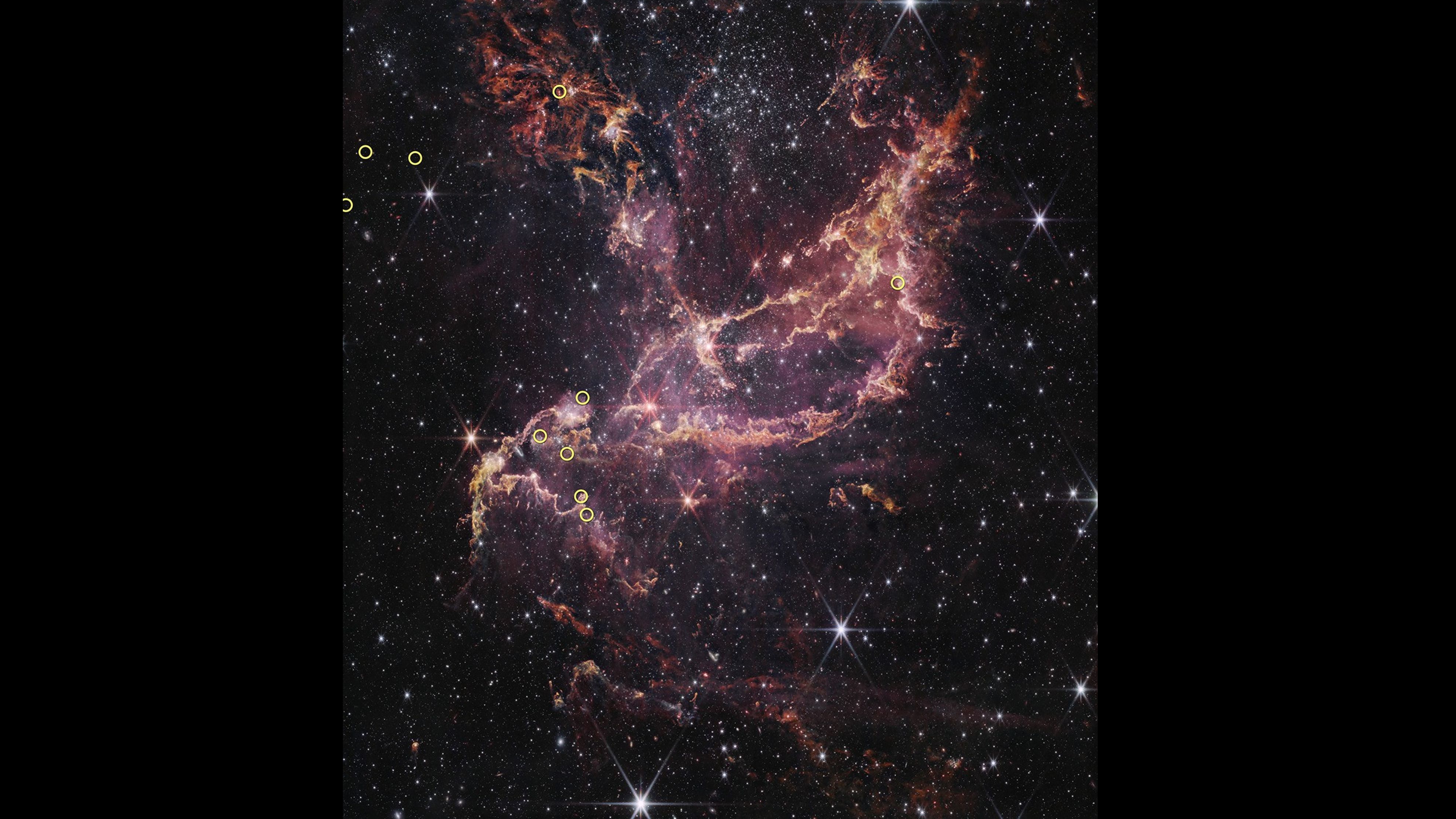 This is a James Webb Space Telescope image of NGC 346, a massive star cluster in the Small Magellanic Cloud, a dwarf galaxy that is one of the Milky Way's nearest neighbors. Ten small, yellow circles overlaid on the image indicate the positions of the 10 stars surveyed in this study. /NASA