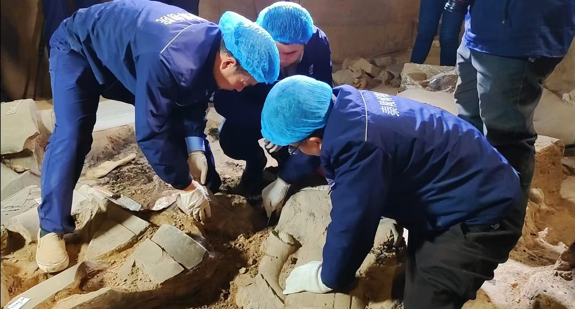 Experts at work during the excavation in Xi'an, northwest China's Shaanxi Province, November 18, 2024. Ruan Chao/China Media Group
