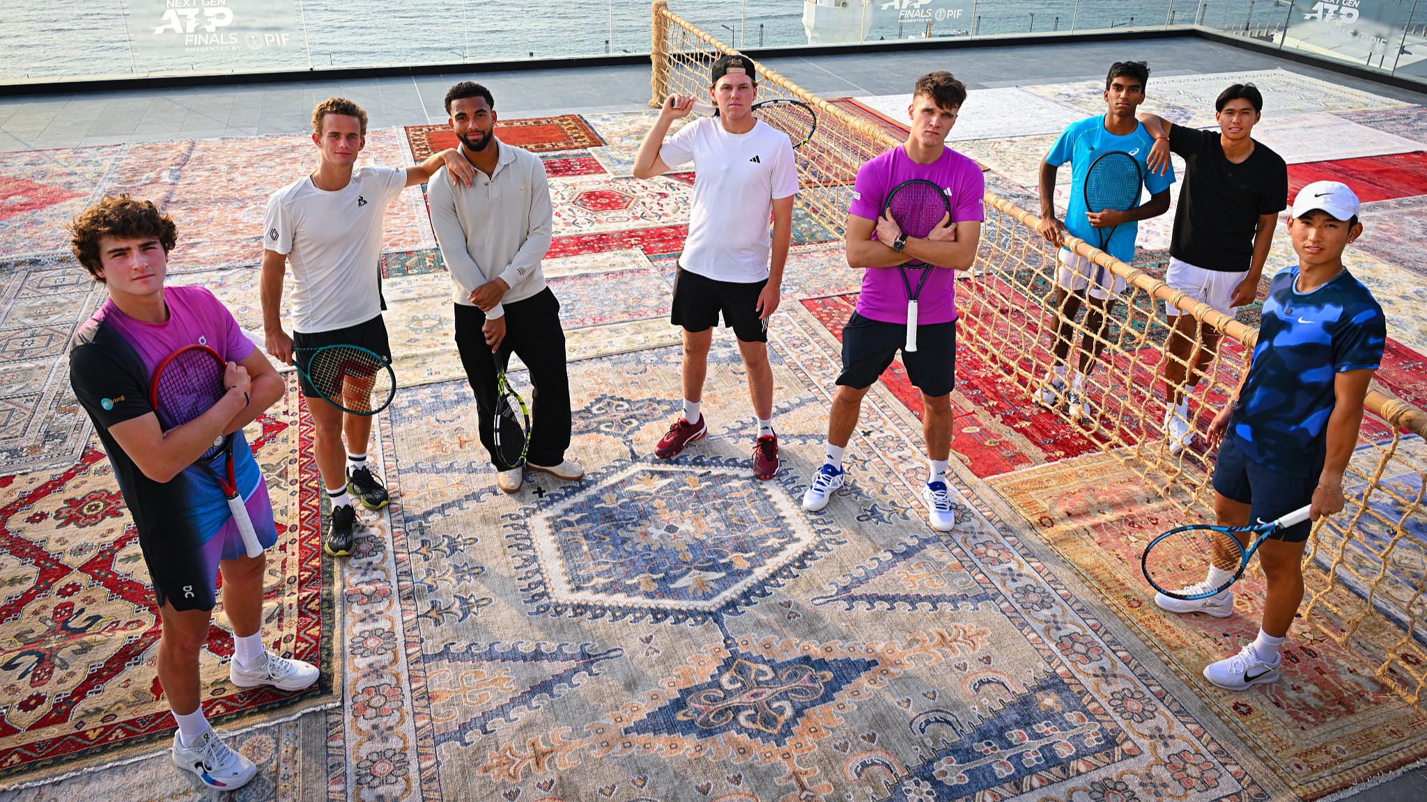 China's Shang Juncheng (R) among eight players to pose at the Royal Overlook Building prior to the Next Gen ATP Finals in Jeddah, Saudi Arabia, December 16, 2024. /CFP