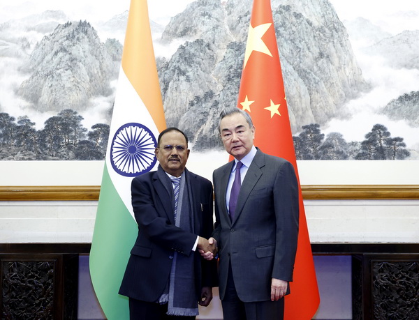 China's special representative Wang Yi, also a member of the Political Bureau of the Communist Party of China Central Committee and director of the Office of the Central Commission for Foreign Affairs, shakes hands with India's special representative and National Security Adviser Shri Ajit Doval in Beijing, China, December 18, 2024. /Chinese Foreign Ministry