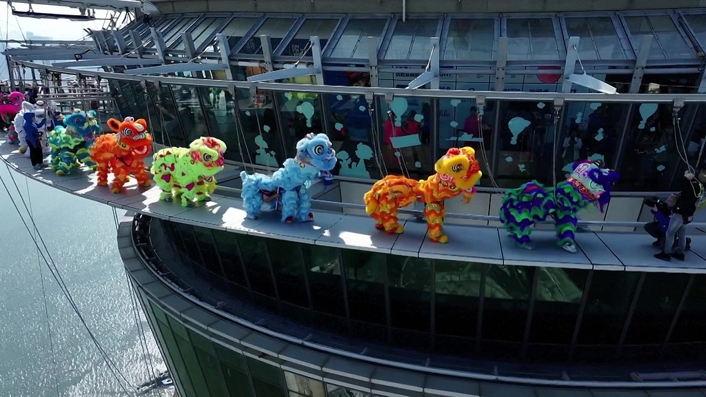 A special lion dance performance takes place on the Macao Tower to mark 25th anniversary of Macao's return to China. /CFP