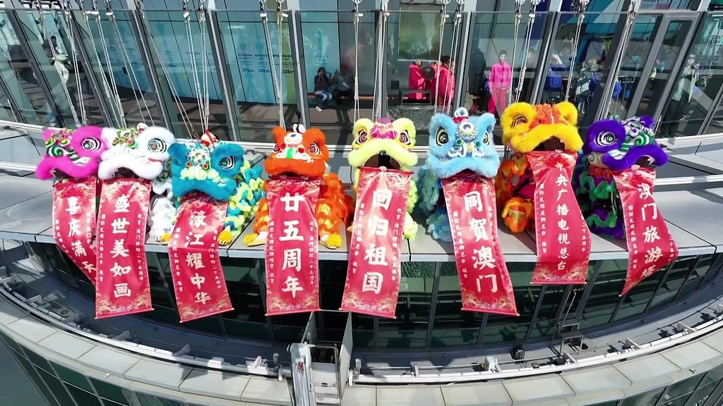 Lion dance soars at Macao Tower for 25th anniversary