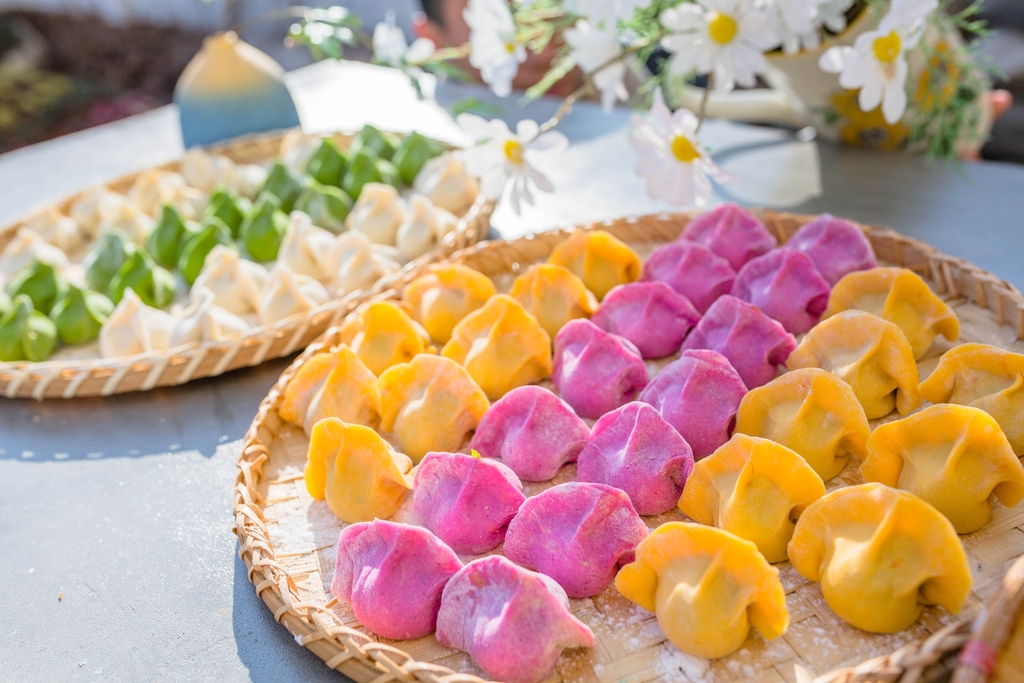 An undated photo shows an assortment of colorful dumplings. /IC