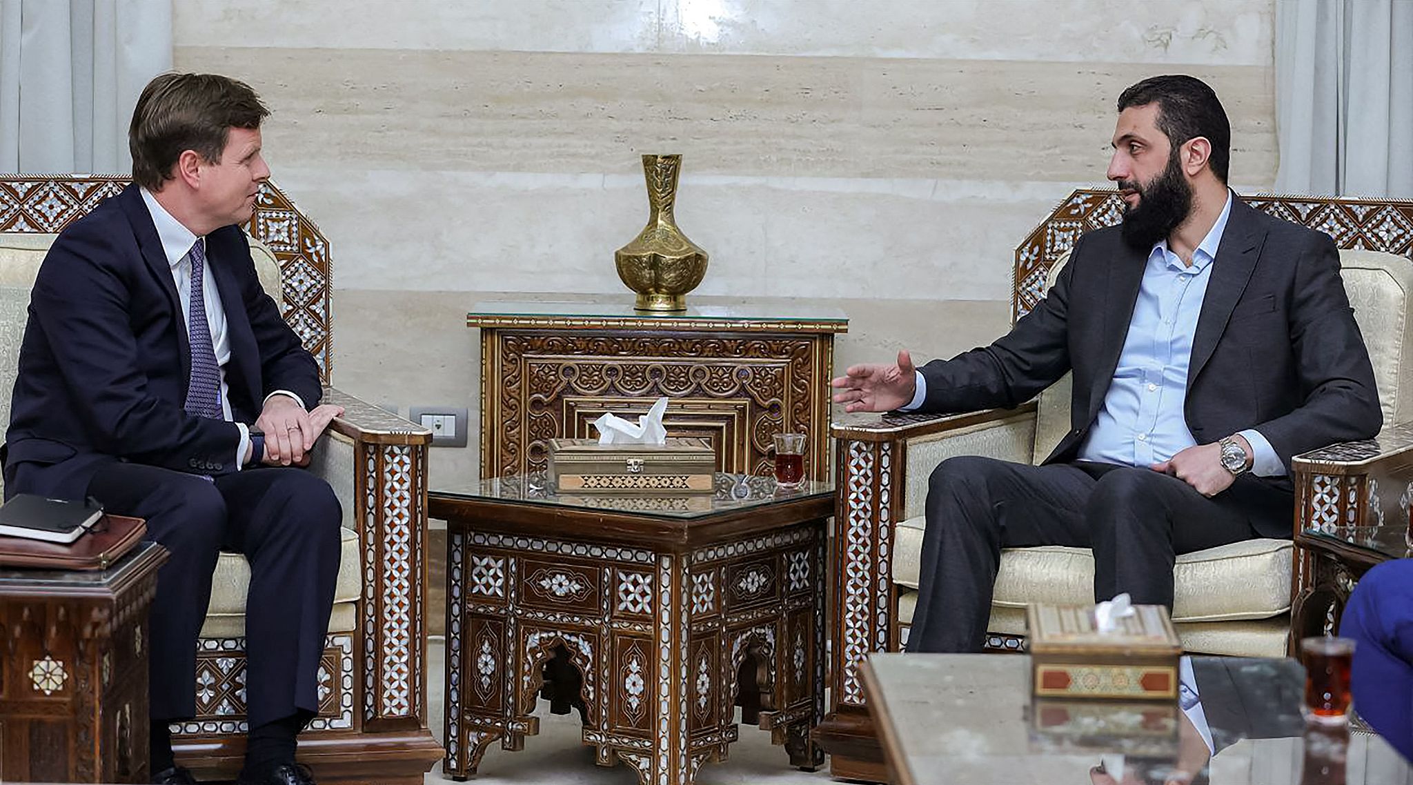 HTS leader Ahmad al-Shara (R) talks with Stephen Hickey, the director of the Middle East and North Africa department at the UK's Foreign, Commonwealth and Development Office, Damascus, Syria, December 17, 2024. /CFP