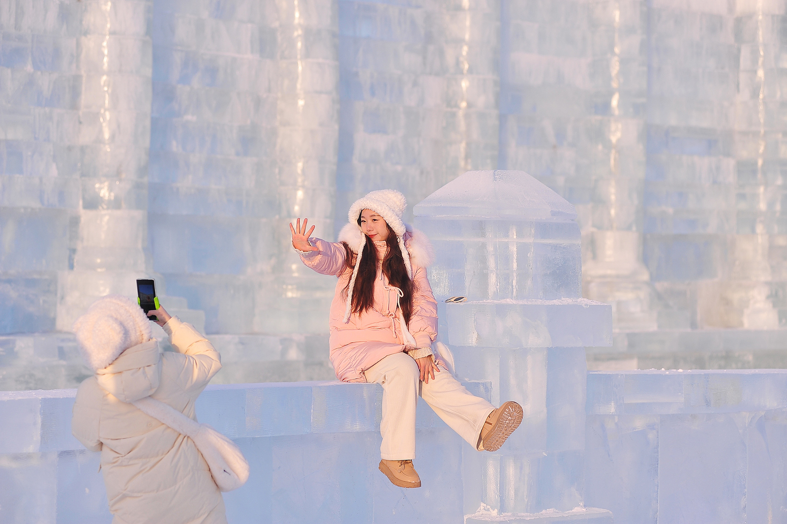 A visitor poses for photos at the Harbin Ice and Snow World in Harbin, Heilongjiang Province on December 21, 2024. /CFP