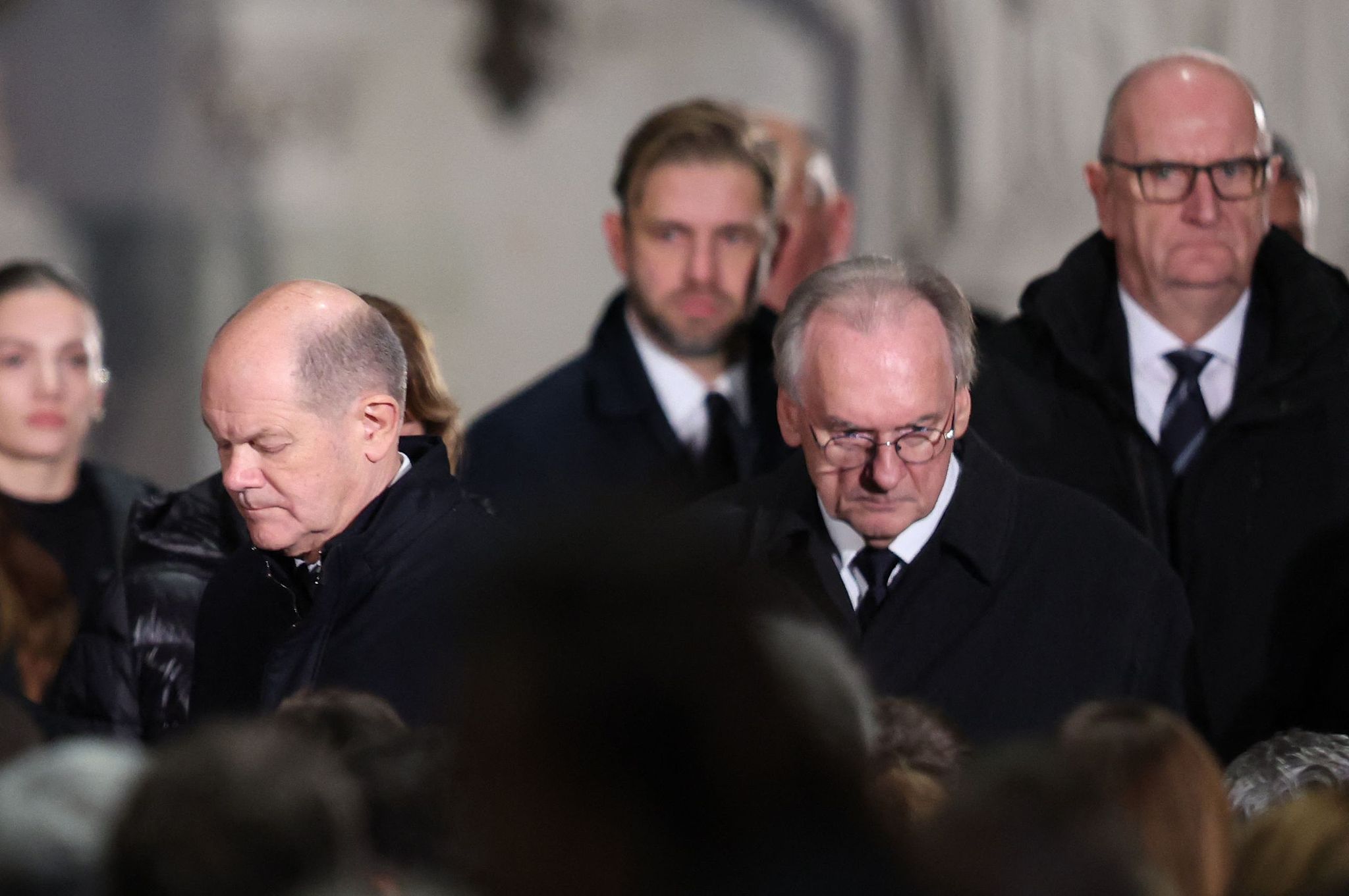 German Chancellor Olaf Scholz and State Premier of Saxony-Anhalt Reiner Haseloff attend a church service one day after a car-ramming attack on a Christmas market in Magdeburg, Germany, December 21, 2024. /CFP