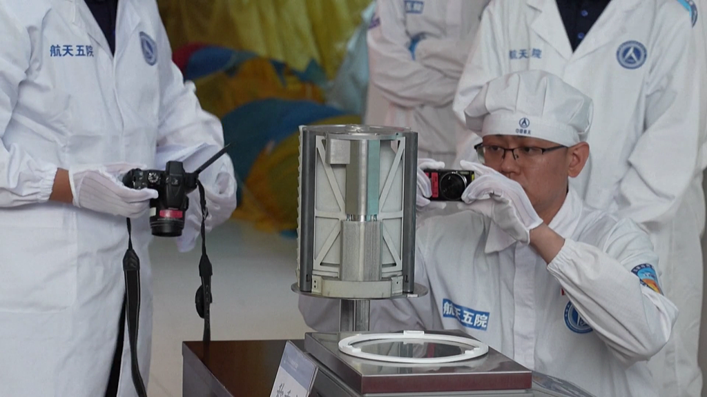 The returner of China's Chang'e-6 lunar probe is opened during a ceremony in Beijing, June 26, 2024. /CFP