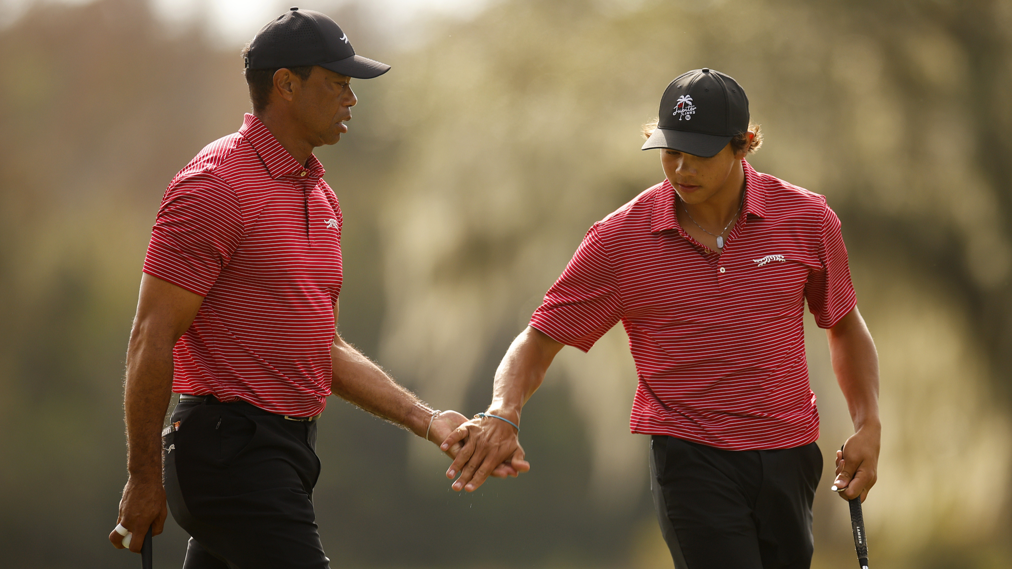 Tiger Woods (L) and his son Charlie Woods (R) compete in the second round of the PNC Championship in Orlando, Florida, December 22, 2024. /CFP