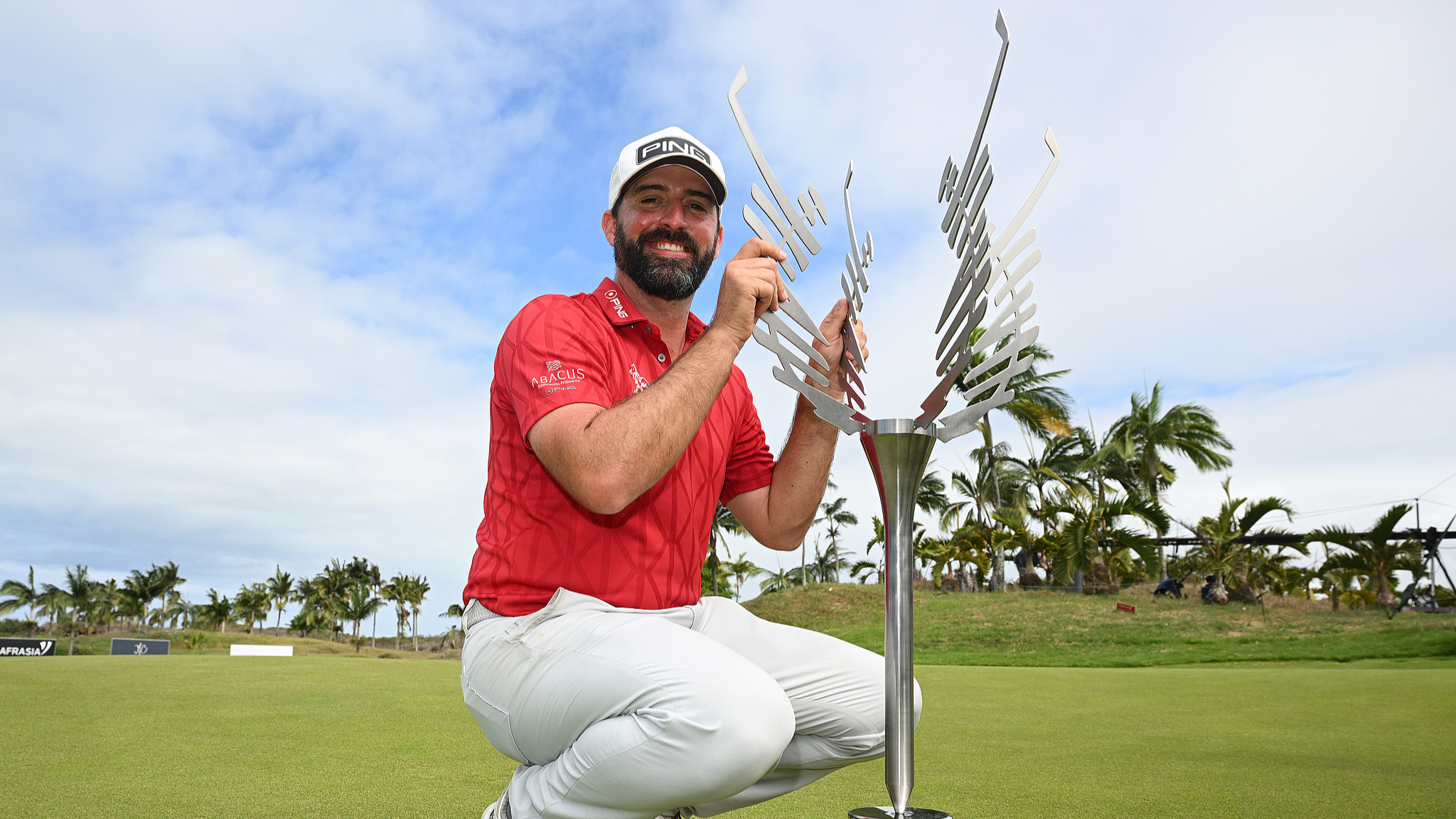 John Parry of England poses with the trophy following victory at the Mauritius Open at Mont Choisy Le Golf, Mauritius, December 22, 2024. /CFP