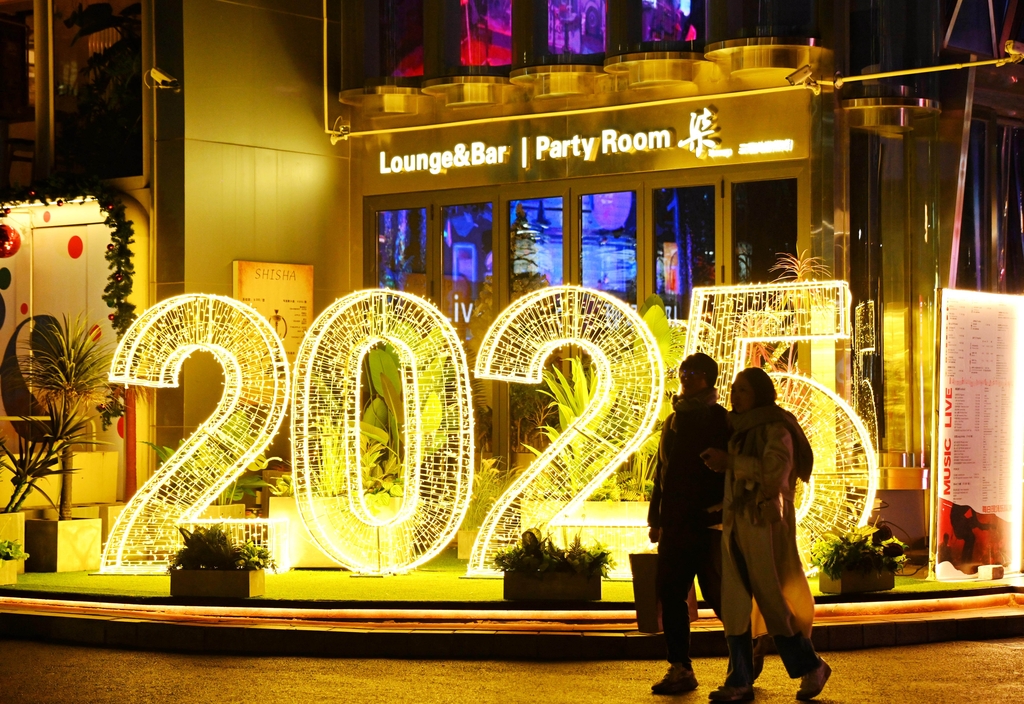 A photo taken on December 23, 2024, shows New Year-themed light installation in Sanlitun, Beijing. /IC