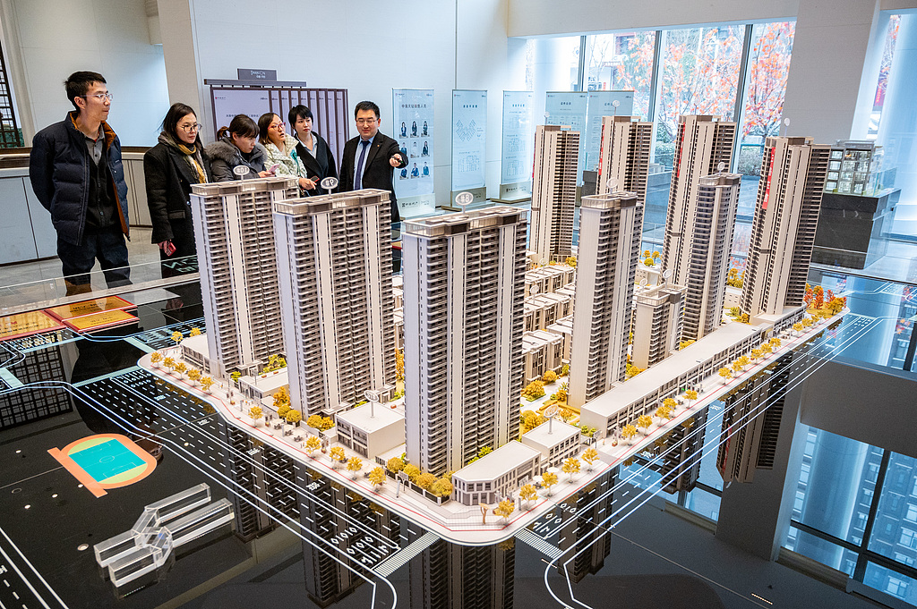 Consultants from a real estate sales department in Taiyuan are promoting commercial housing for the public, Shanxi Province, China, February 28, 2024. /CFP