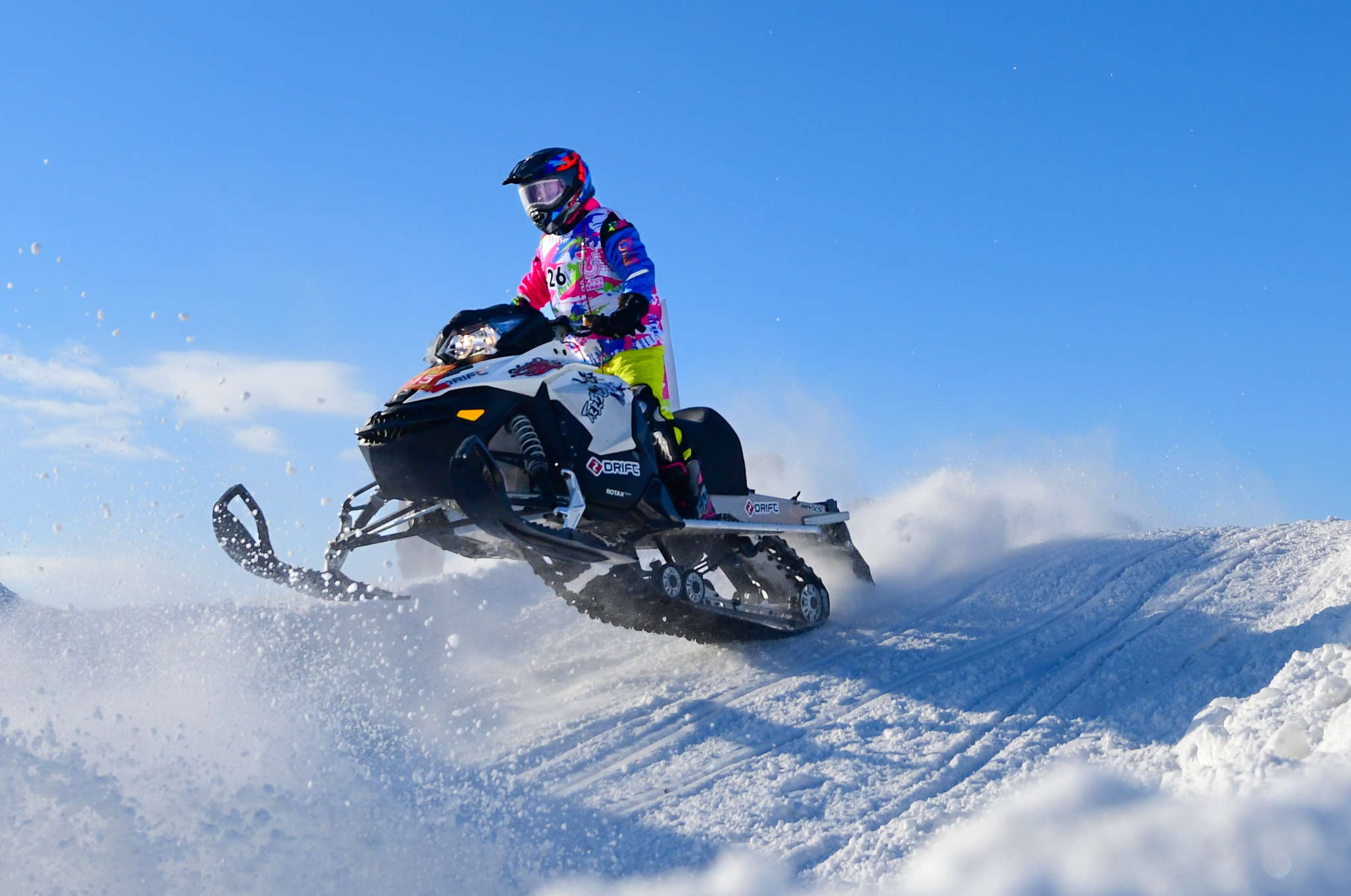 A competitor takes part in the snowmobile cross-country grand prix at the 7th Winter Heroes Games in Inner Mongolia on December 25, 2024. /CFP