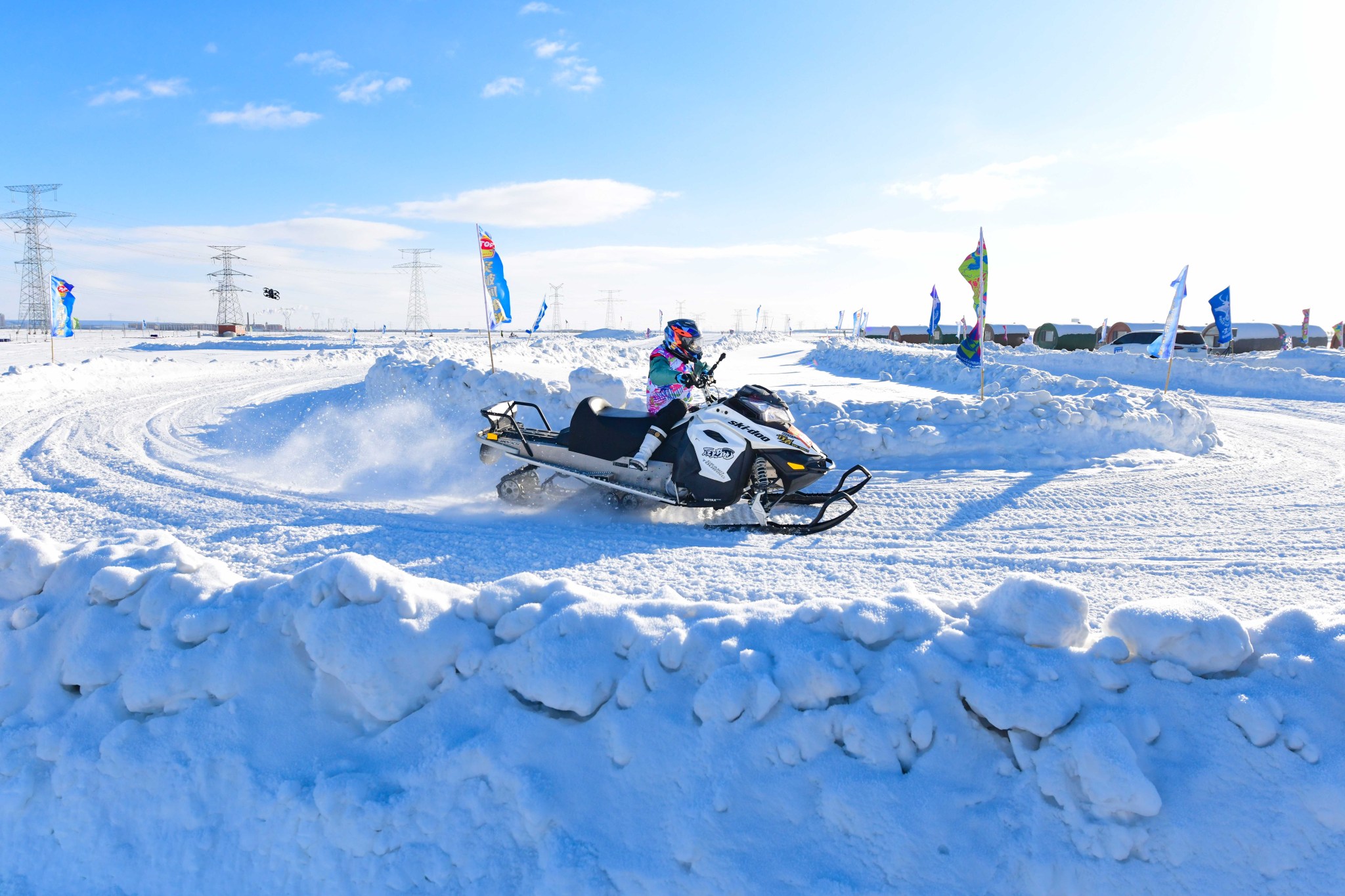 A competitor takes part in the snowmobile cross-country grand prix at the 7th Winter Heroes Games in Inner Mongolia on December 25, 2024. /CFP