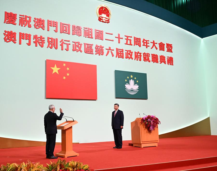 Chinese President Xi Jinping (R), also general secretary of the Communist Party of China Central Committee and chairman of the Central Military Commission, administers the oath of office to Sam Hou Fai, new chief executive of the Macao Special Administrative Region (SAR), at the Macao East Asian Games Dome in Macao, south China, December 20, 2024. /Xinhua