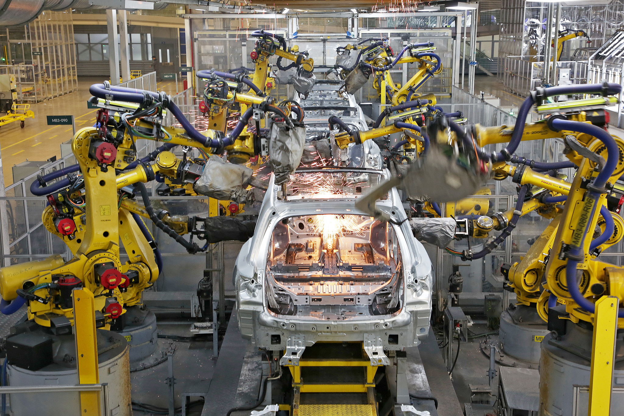 Robotic arms perform automated welding on car bodies at a workshop in Changzhou, Jiangsu Province, China, December 10, 2024. /CFP