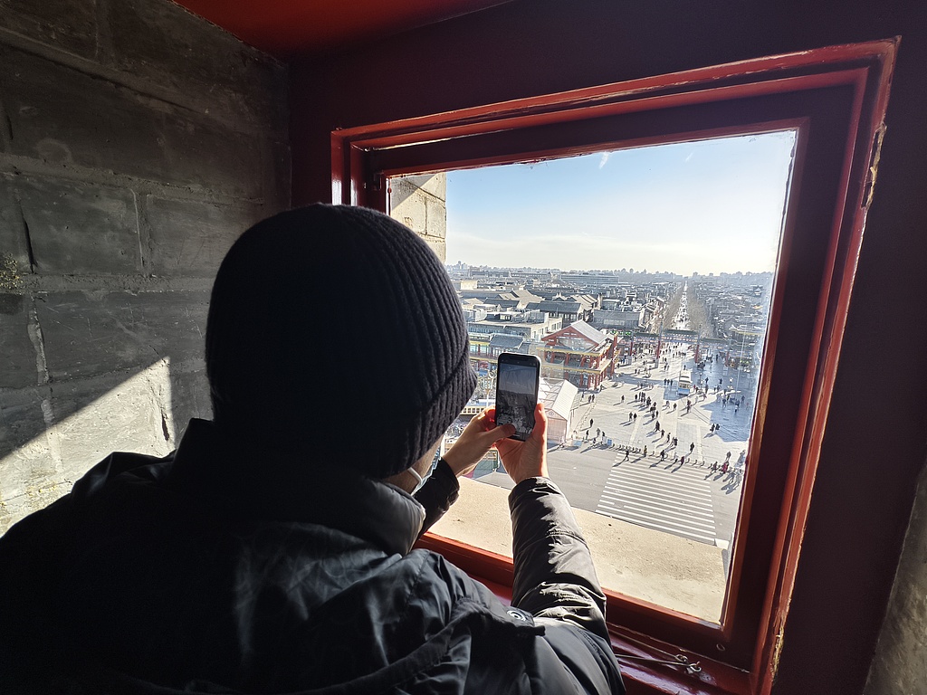 A visitor views Beijing's Central Axis from the Arrow Tower of Zhengyangmen on December 26, 2024. /CFP