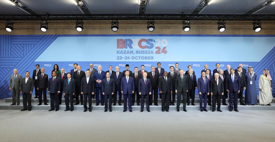 Chinese President Xi Jinping poses for a group photo with other leaders and representatives attending the 