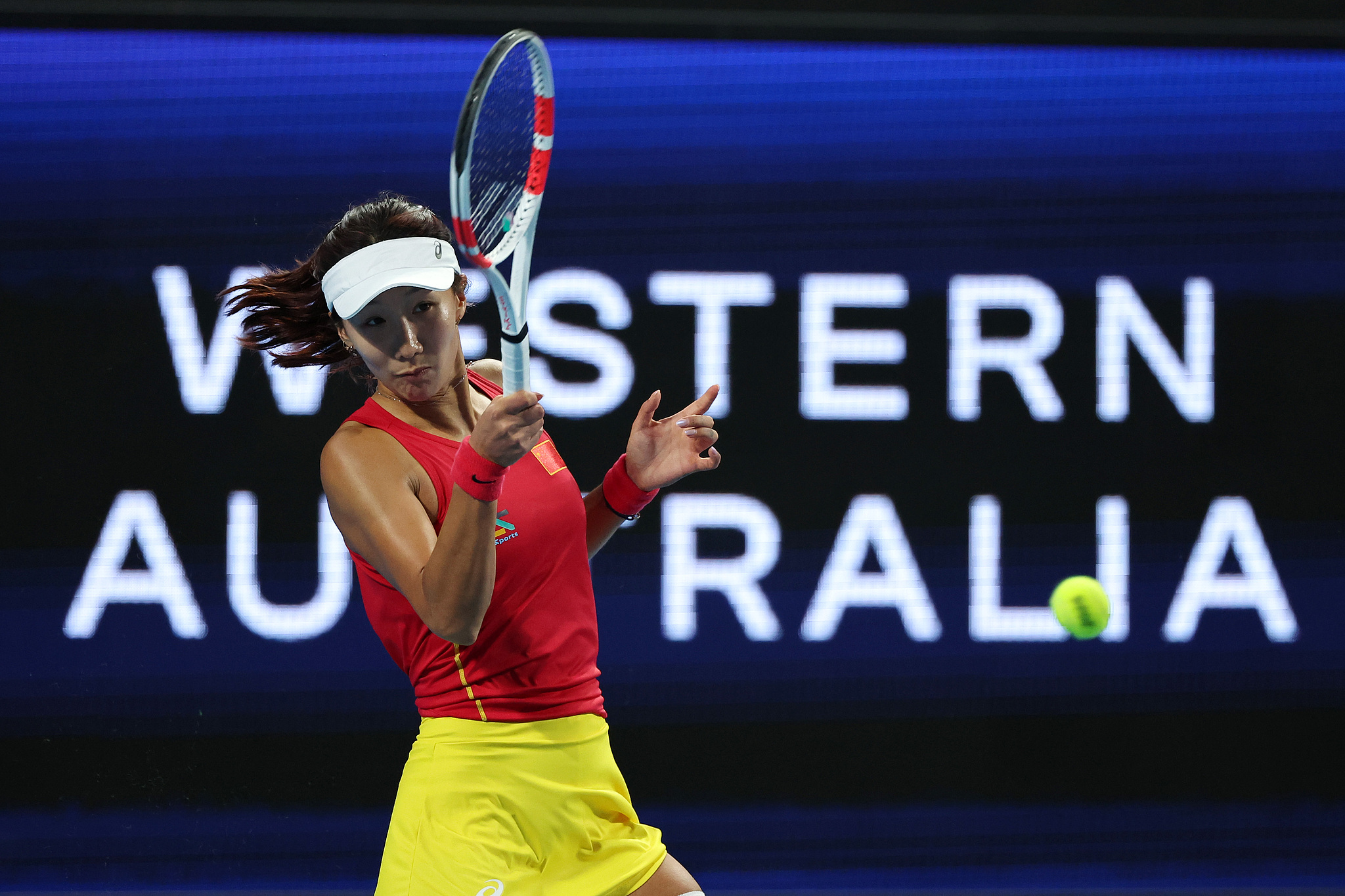 Gao Xinyu of China hits a shot against Beatriz Haddad Maia of Brazil in a women's singles match at the United Cup in Perth, Australia, December 27, 2024. /CFP