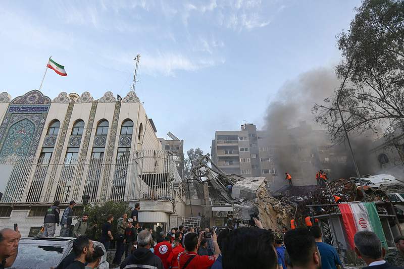 Emergency and security personnel search the rubble at the site of strikes which hit a building annexed to the Iranian embassy in Syria's capital Damascus, April 1, 2024. /CFP