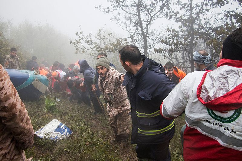 Rescue team members work at the crash site of a helicopter carrying Iranian President Ebrahim Raisi in Varzaghan, in northwestern Iran, May 20, 2024. /CFP