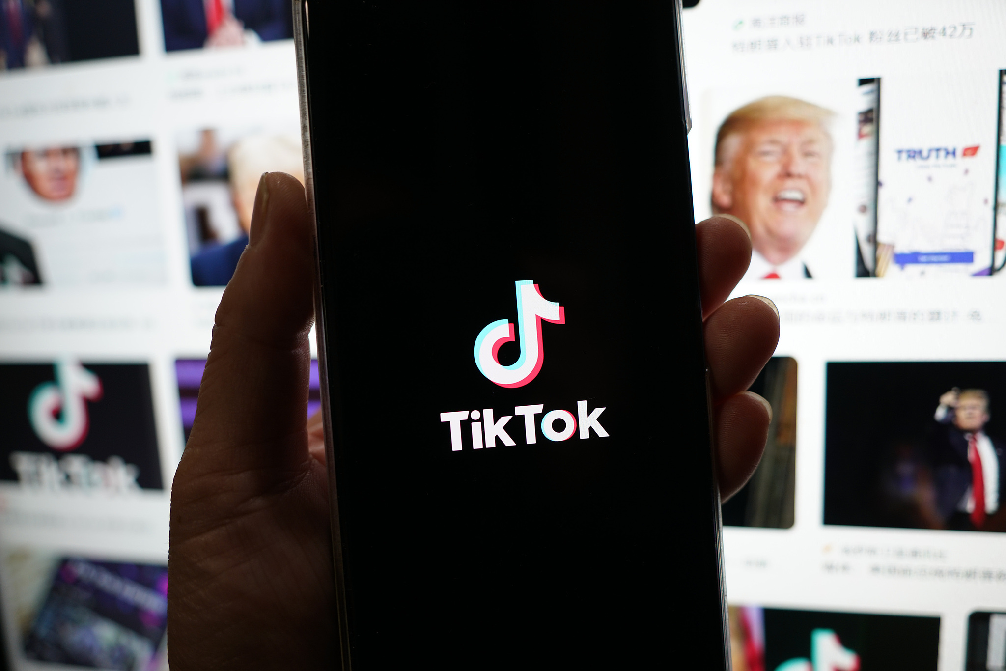 TikTok's logo is displayed on a smartphone. /CFP