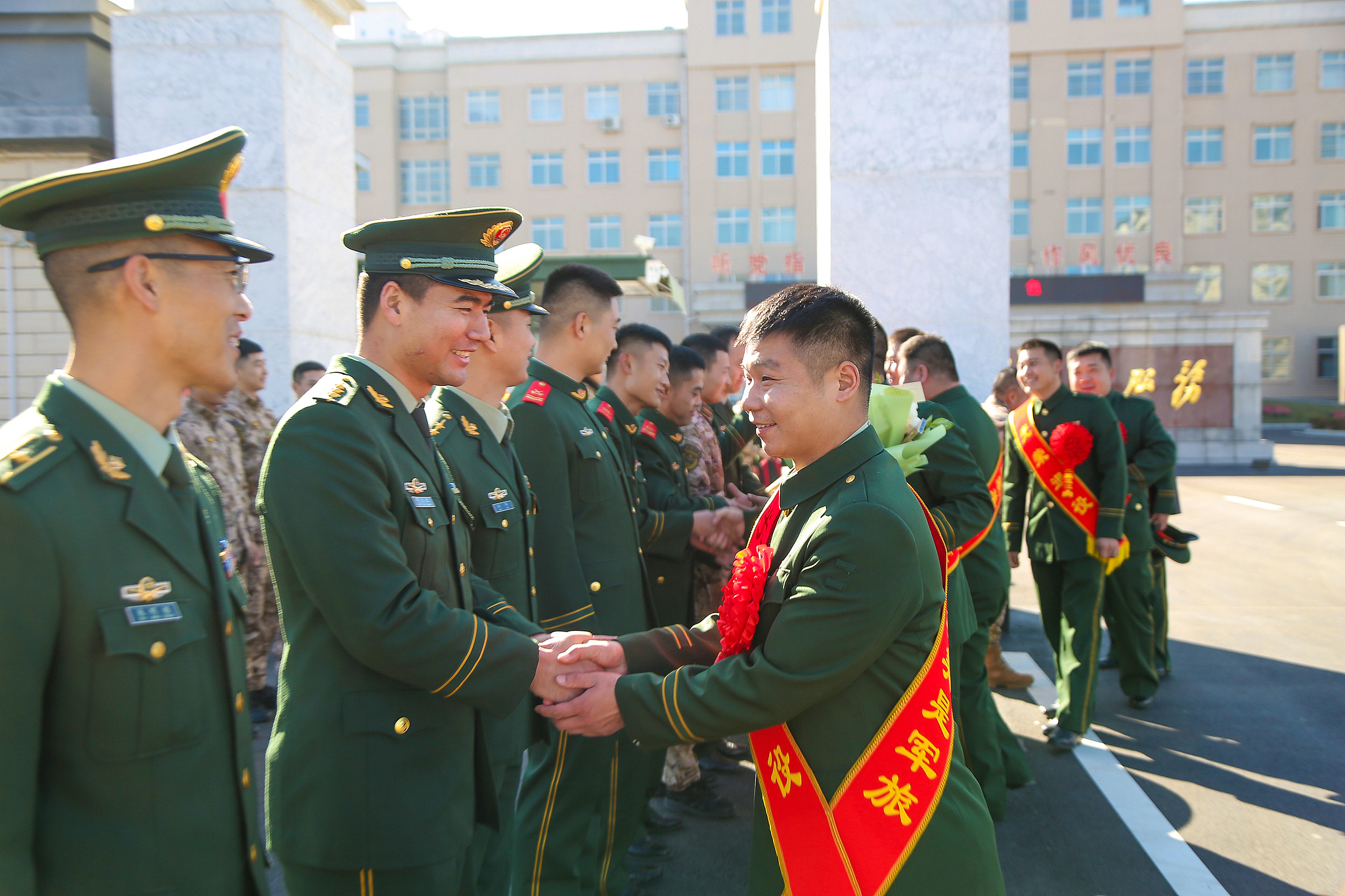 Veterans shake hands with soldiers in Pingliang City, northwest China's Gansu Province, December 1, 2024. /CFP