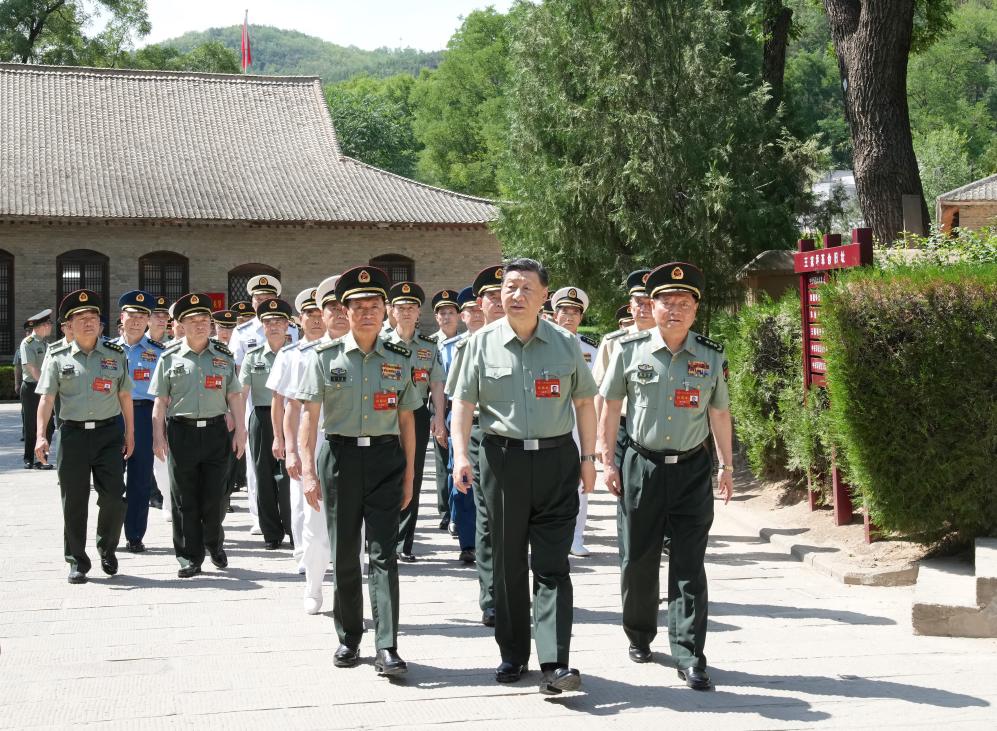 Chinese President Xi Jinping, also general secretary of the CPC Central Committee and chairman of the CMC, leads CMC members and heads of various departments and units to visit the revolutionary relics at Wangjiaping in Yan'an, northwest China's Shaanxi Province, June 17, 2024. /Xinhua