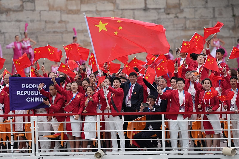 Members of the Chinese delegation are seen on a boat on the River Seine during the opening ceremony of the Paris 2024 Olympic Games in Paris, France, July 26, 2024. /CFP