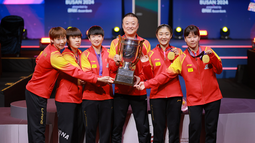 Chinese women's team lift trophy at the ITTF World Team Table Tennis Championships Finals in Busan, South Korea, February 24, 2024. /CFP