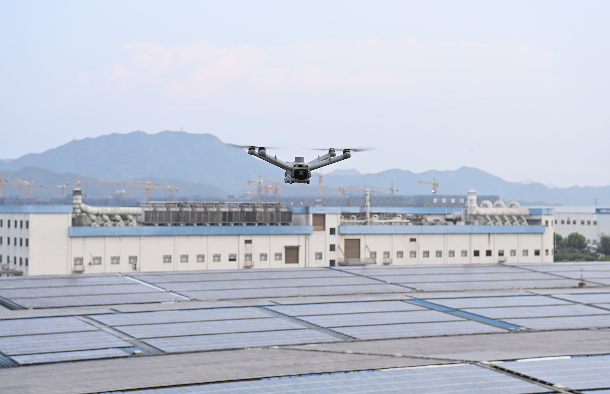 A drone equipped with an infrared camera patrols a solar farm in Dongyang City, east China's Zhejiang Province, August 9, 2024. /CFP