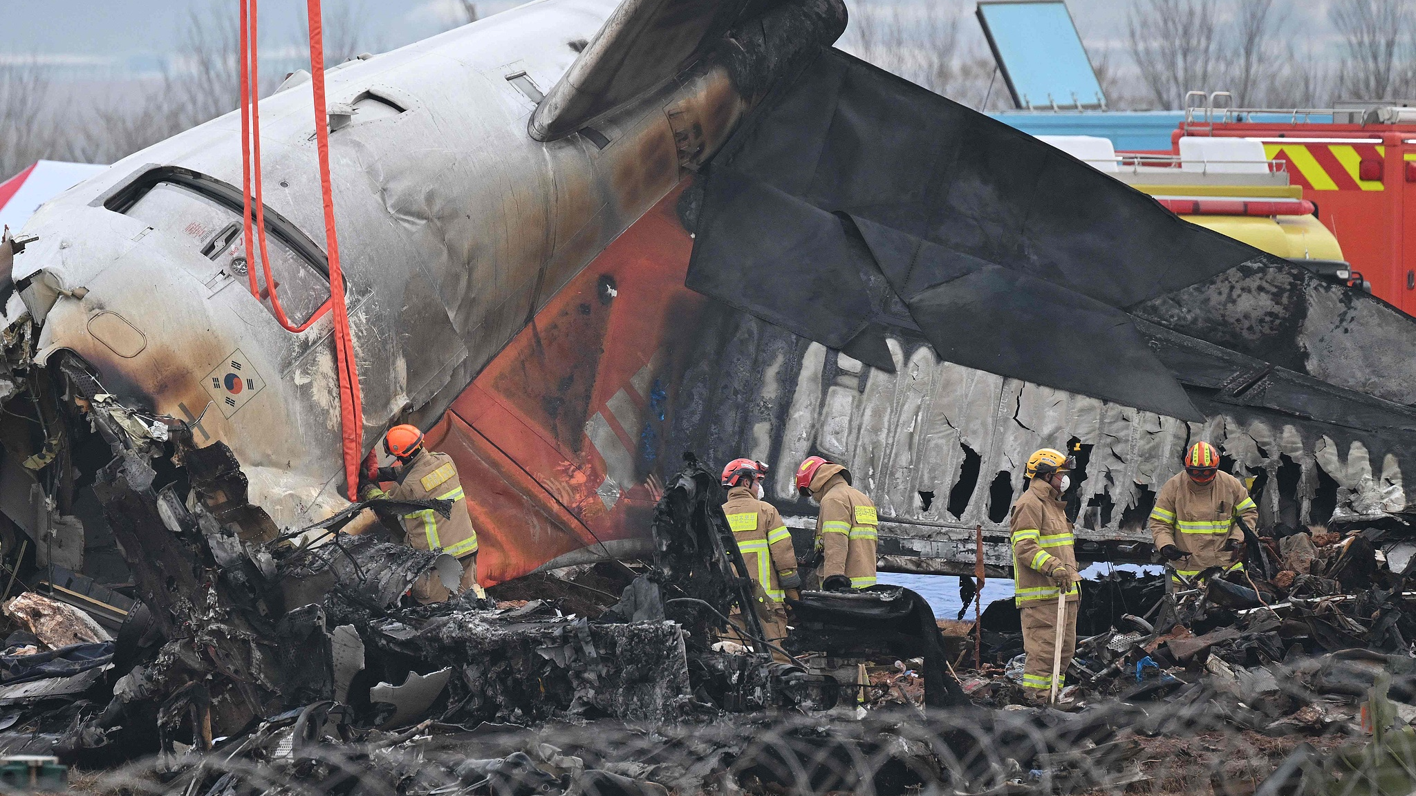 Firefighters and recovery teams work at Muan International Airport in Muan, South Korea, December 30, 2024. /CFP
