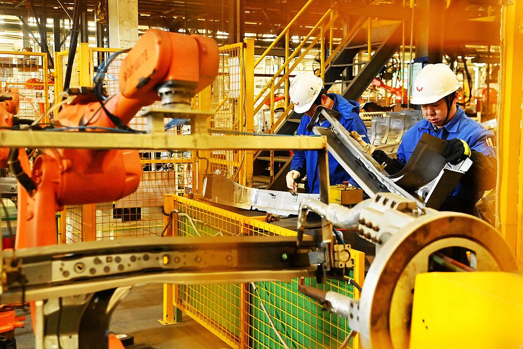 Workers produce auto parts on an assembly line of a company in Qingdao, Shandong Province, China, November 30, 2024. /CFP