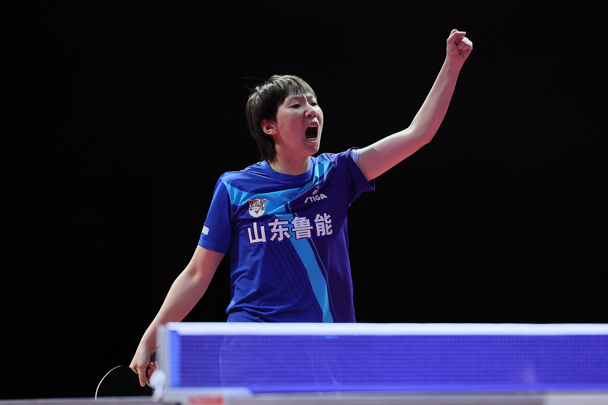 Wang Manyu of Shandong Luneng reacts after scoring a point in the women's singles match against Qin Yuxuan of Shenzhen University in the China Table Tennis Super League women's team final in east China's Shanghai Municipality, January 1, 2025. /CFP