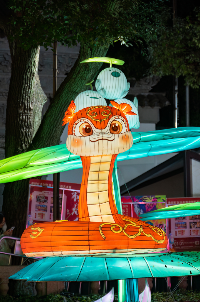 A coiled snake-shaped lantern glows at the Yuyuan Garden Lantern Festival in Shanghai on January 1, 2025. /CFP