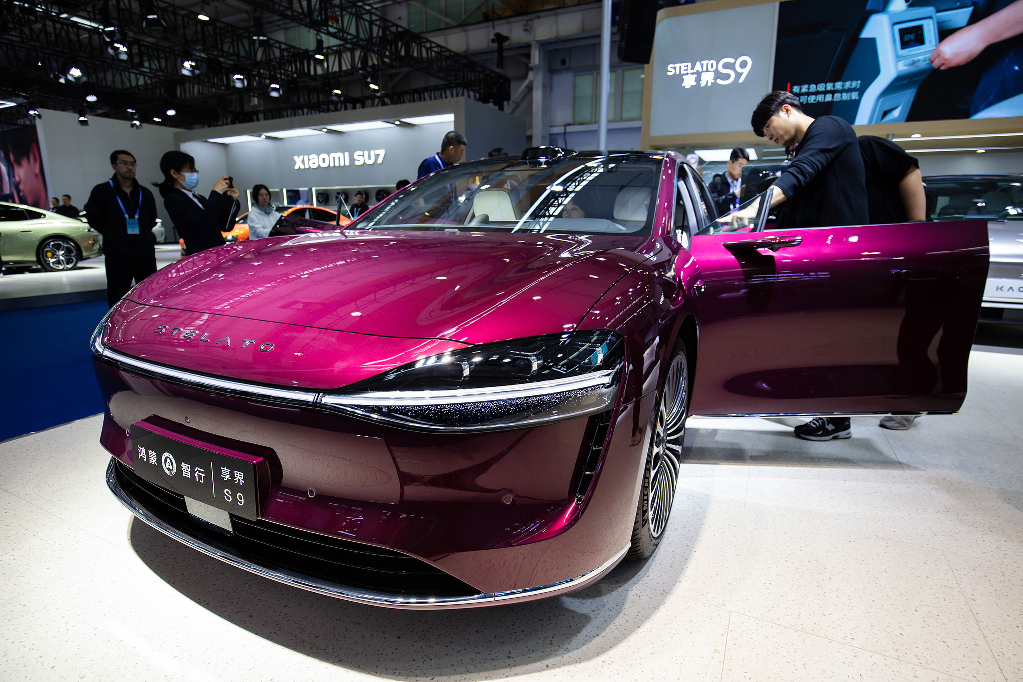 Visitors explore a new energy vehicle at an auto show in Beijing, China, October 17, 2024. /CFP