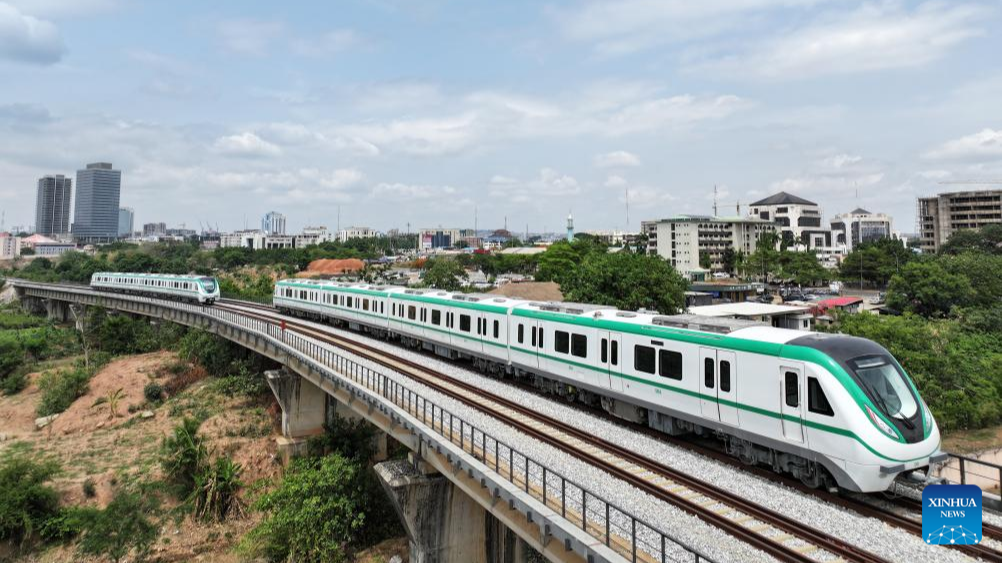 Chinese-made electric multiple unit (EMU) trains run on the metro rail track in Abuja, Nigeria, May 23, 2024. /Xinhua